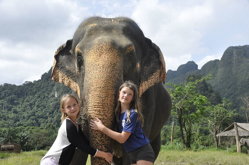 Ava and Edie washing elephants in Thailand